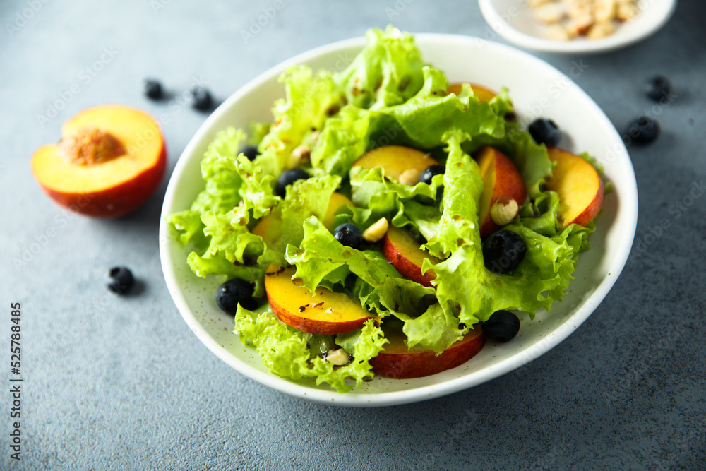 Healthy leaf salad with peach and blueberry Healthy leaf salad with peach and blueberry