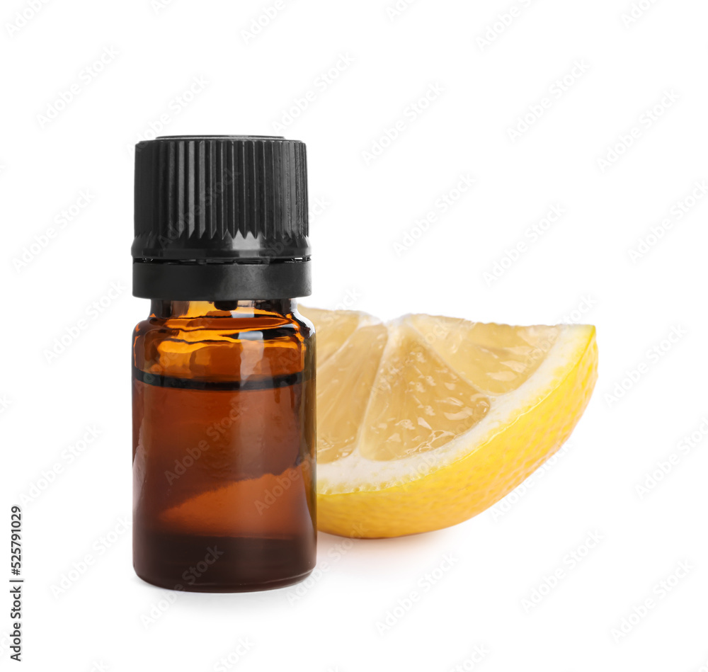 Bottle of citrus essential oil and cut fresh lemon isolated on white Bottle of citrus essential oil and cut fresh lemon isolated on white
