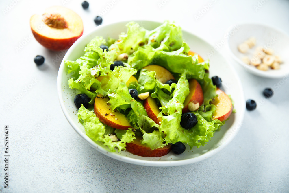 Healthy leaf salad with peach and blueberry Healthy leaf salad with peach and blueberry