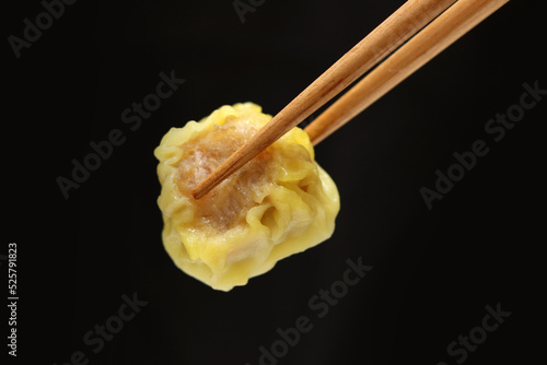 Siu Mai, Shumai,  Chinese steamed dumplings, dimsum chopsticks. photo