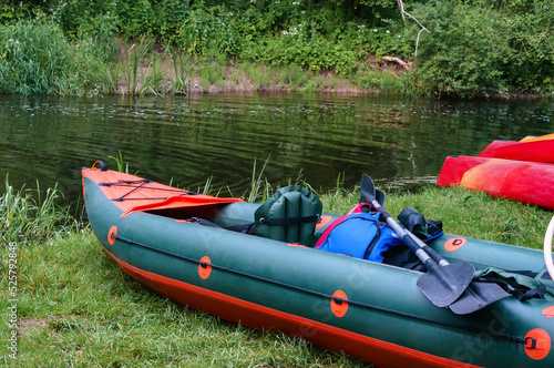 Canoeing trip on the river. Rafting in kayaks. Active recreation on the water.