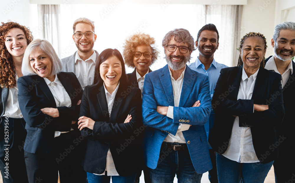 Multiracial business people looking at camera inside bank office - Focus on front faces Multiracial business people looking at camera inside bank office - Focus on front faces