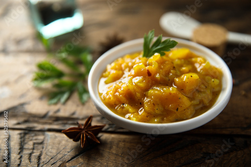 Traditional homemade mango chutney with spices photo