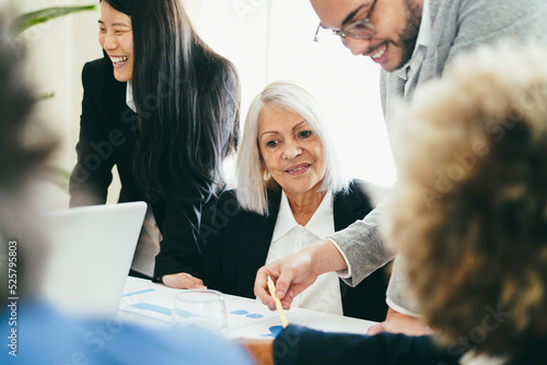 Photography Multiracial business people working inside bank office - Soft focus on senior wo