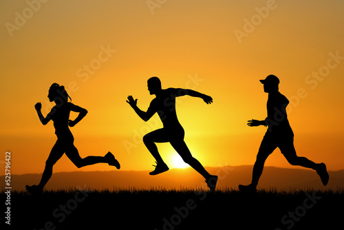 people jogging in the meadow in the evening