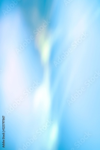 Blurred water texture overlay effect for photo and mockups. Organic drop diagonal shadow and light caustic effect on a blue wall. Shadows for natural light effects