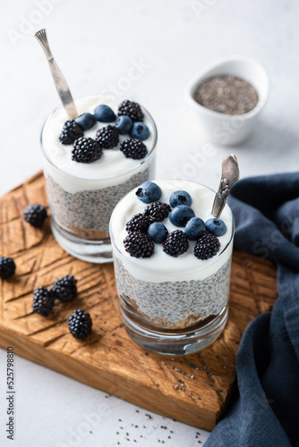 Vászonkép Vegan Yogurt Chia Pudding With Berries And Granola Layer In Jar, Closeup View