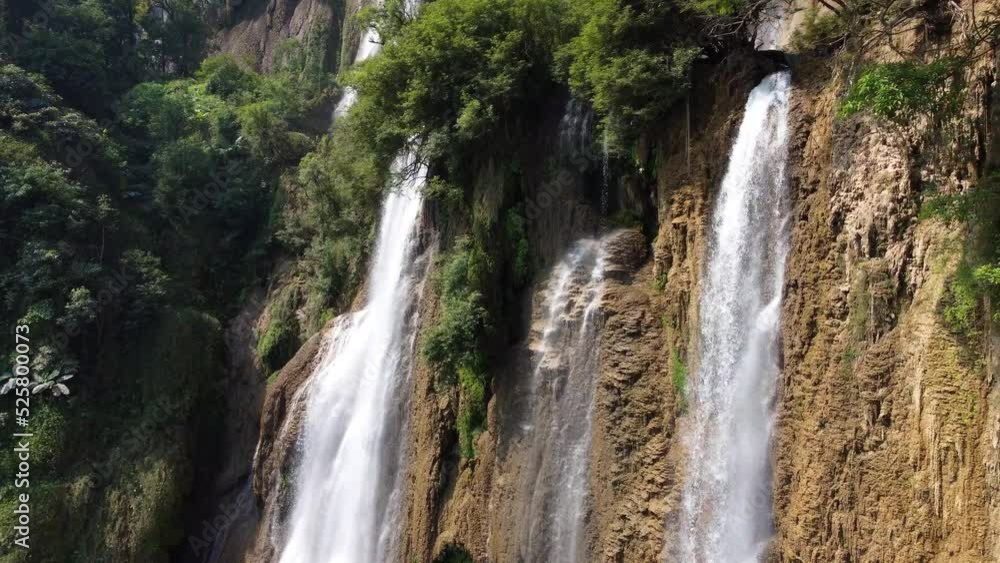 A stunning drone shot flying beside Thi Lo Su Waterfall, located deep in the jungle, off the beaten track of North Thailand in the area of Umphang in Southeast Asia A stunning drone shot flying beside Thi Lo Su Waterfall, located deep in the jungle, off the beaten track of North Thailand in the area of Umphang in Southeast Asia