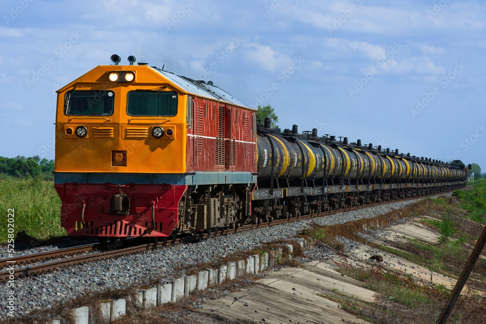 Tanker-freight train by diesel locomotive on the railway in Thailand