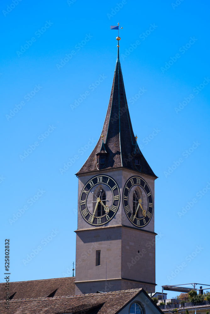 Famous St. Peter church at the old town at City of Zürich on a sunny summer day. Photo taken July 2nd, 2022, Zurich, Switzerland.