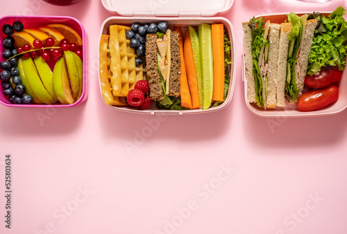 Healthy lunch to go. Sandwitches, Fruits and vegetables packed in lunch box