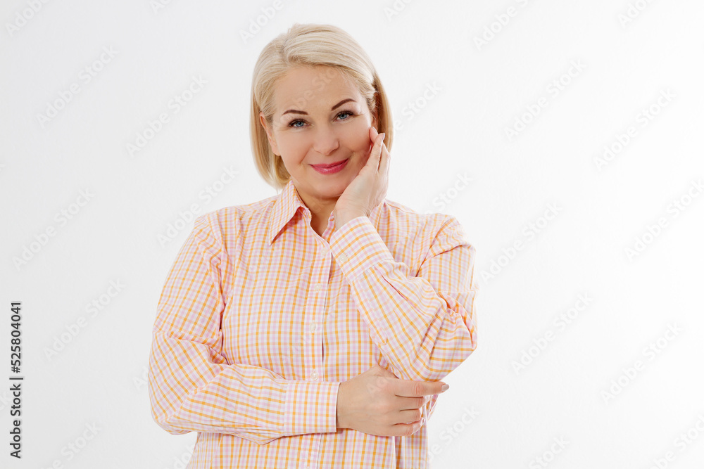 Happy beautiful close up portrait middle age blonde woman. Mid aged healthy female isolated on white background with copy space. Menopause and healthcare. Mature lady wrinkled face. Folded hands Happy beautiful close up portrait middle age blonde woman. Mid aged healthy female isolated on white background with copy space. Menopause and healthcare. Mature lady wrinkled face. Folded hands