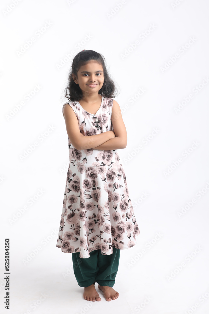 Cute Indian girl standing on white background. Cute Indian girl standing on white background.