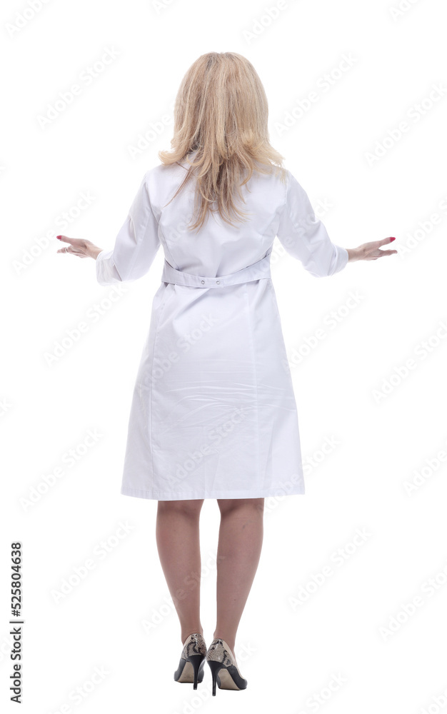rear view. a woman doctor reading an ad on a white screen. rear view. a woman doctor reading an ad on a white screen.