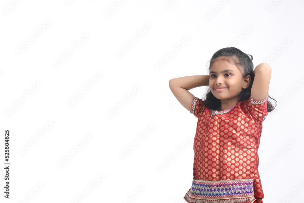 Indian little girl in traditional wear and giving expression on white background. Indian little girl in traditional wear and giving expression on white background.