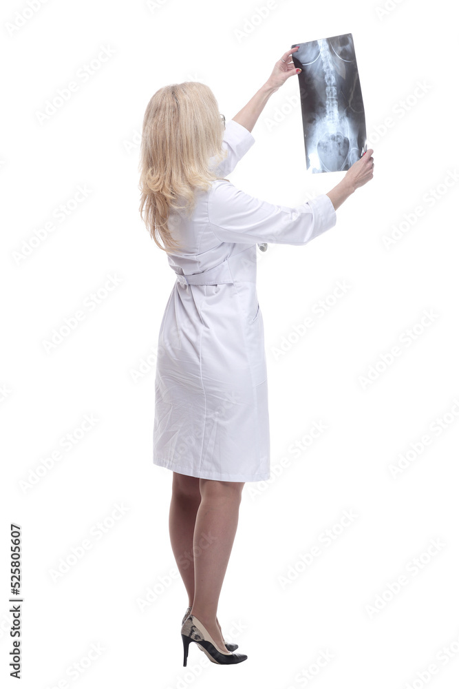 female doctor carefully looking at the x-ray. isolated on a white