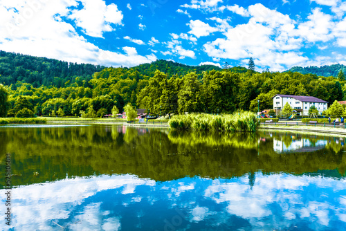 Landscape of the Noua lake and vegetation in summer season in Brasov town, Romania