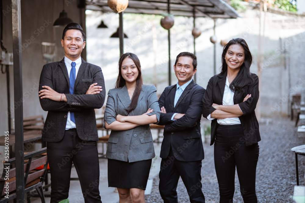 Fototapeta premium portrait of business asian partner smiling to camera with crossed arm