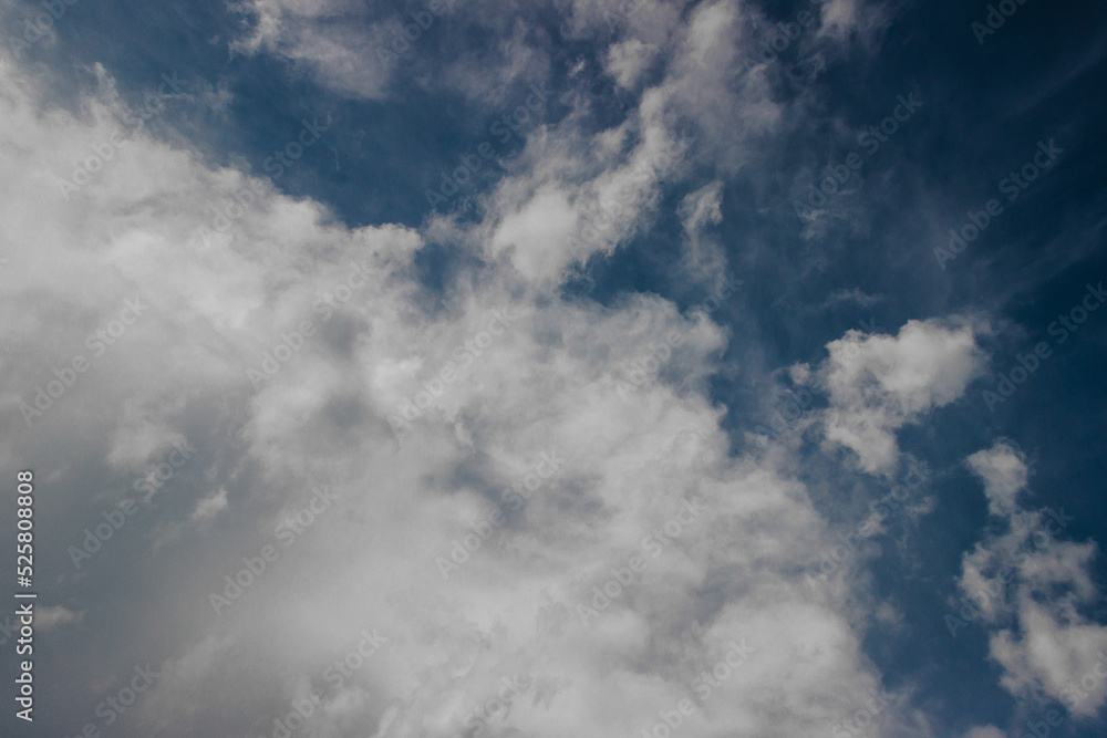 white clouds between the blue sky white clouds between the blue sky