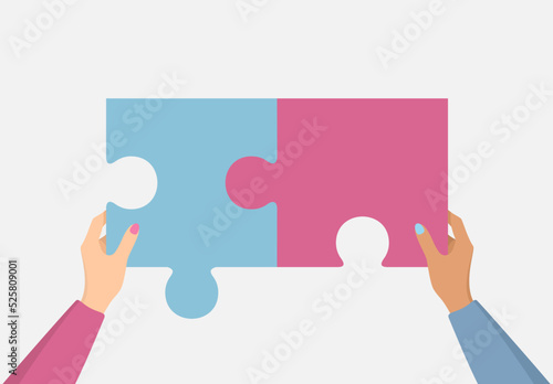 Female hands putting together blue and pink puzzle pieces on a gray background. Flat vector illustration