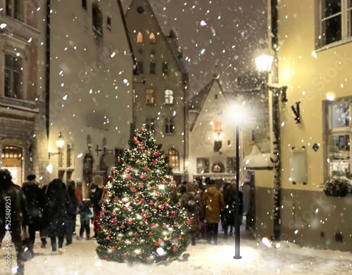 Winter Christmas tree decotaion on street in medieval city Tallinn old town photo