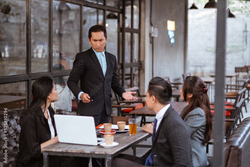 Fototapeta premium portrait of asian business people having an argument during meeting with partner