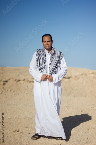 Arab man in national clothes in the desert.