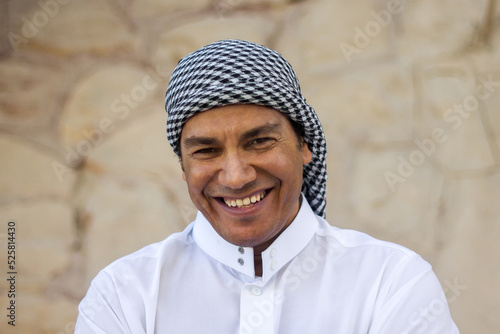 Portrait of a happy Arab man. The Arab laughs. photo