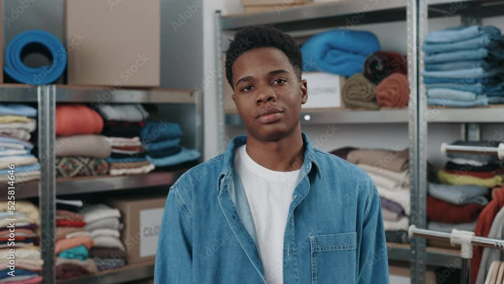 Portrait view of the confident male retail seller, entrepreneur, clothing store small business owner, supervisor looking at camera standing arms crossed in delivery shipping warehouse Portrait view of the confident male retail seller, entrepreneur, clothing store small business owner, supervisor looking at camera standing arms crossed in delivery shipping warehouse