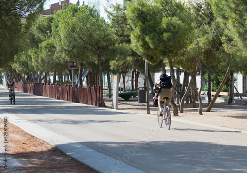 Person on a bike in a city park, healthy lifestyle © pedro