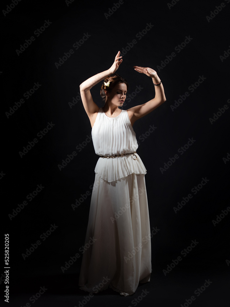 An ancient heroine, a young woman in the image of an ancient Greek goddess or muse. A noble heroine in a white tunic and a laurel wreath, dancing on a black background An ancient heroine, a young woman in the image of an ancient Greek goddess or muse. A noble heroine in a white tunic and a laurel wreath, dancing on a black background