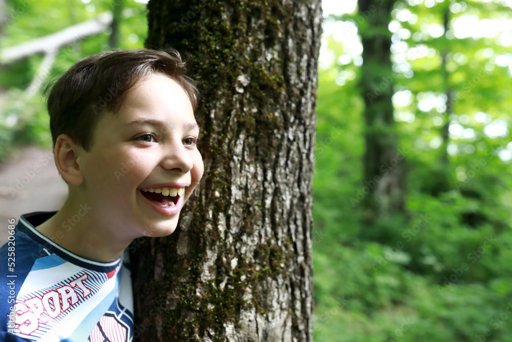 Portrait of smiling boy in forest Portrait of smiling boy in forest