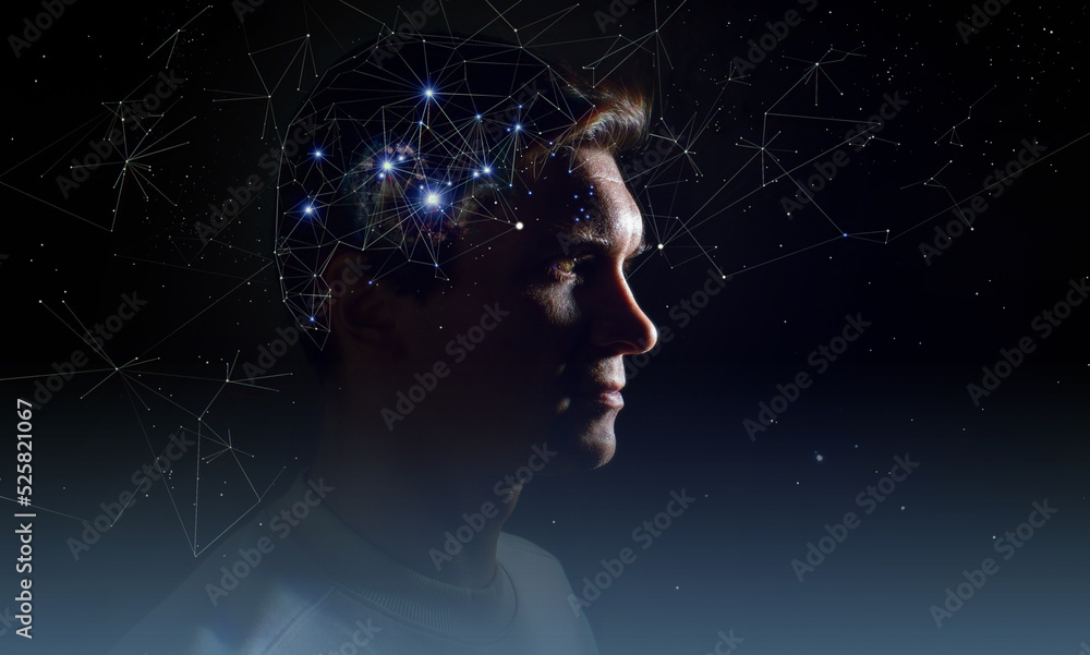 The profile of a thoughtful young man, the concept of brain activity of self-knowledge and personality development. Thinking like stars, the cosmos inside human, background night sky The profile of a thoughtful young man, the concept of brain activity of self-knowledge and personality development. Thinking like stars, the cosmos inside human, background night sky