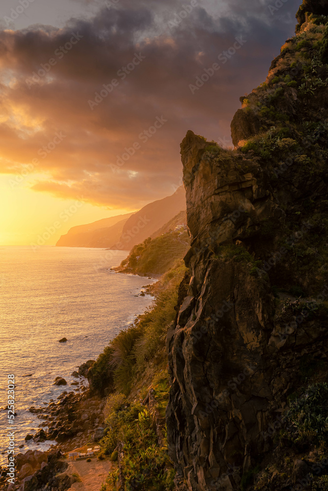 Long exposure waves hitting the coast of Madeira at Ponta do Sol during a summer sunset Long exposure waves hitting the coast of Madeira at Ponta do Sol during a summer sunset