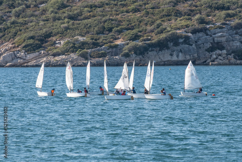 Canvas Print Young optimist racers drilling on Aegean Coast of Turkey.
