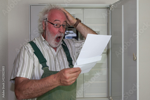 The older man's blood rushes to his head and he tears his hair as he looks at his new electric bill. It will make a dent in the wallets of many consumers this year. photo
