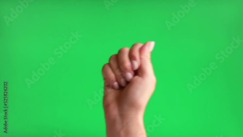 Gestures pack. Female Hand with Beige Manicure hand Knocking isolated on Chroma key Green Screen Background. Body Language. 4K Footage Pack. Close Up. Hand making knock knock. photo
