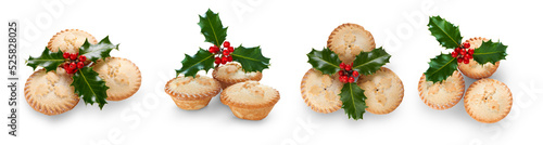 Obraz na płótnie A collection of Christmas mince pies with holly isolated against a flat background. w salonie