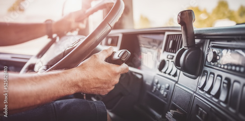 фотографія Driver of semi-truck sitting and drining his vehicle