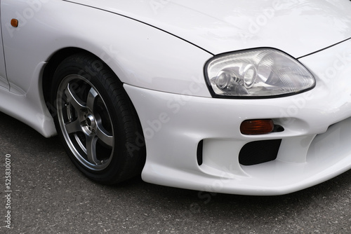 front headlight of white car close-up © Irina