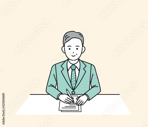 書類を作成する　記入する　書く　手続き　スーツ姿の男性　中年　会社員　ビジネスマン