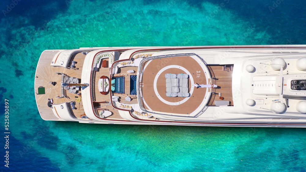 Aerial drone top down ultra wide photo of luxury yacht anchored in ...