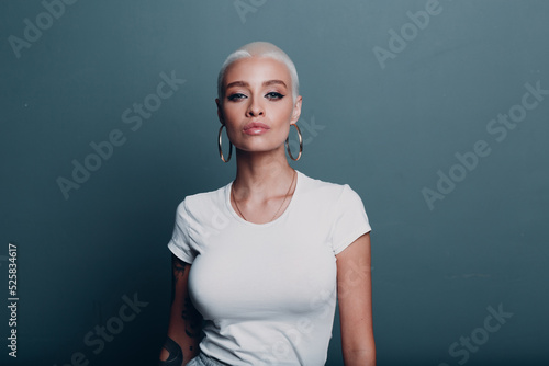Millenial young woman with short blonde hair and big boobs tits portrait
