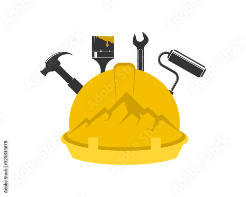helmet and tools building with mountain inside