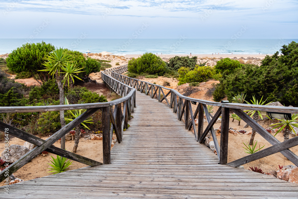 wooden walkways, access to La Barrosa beach in Sancti Petri, Cadiz, Spain
