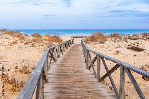 wooden walkways  access to La Barrosa beach in Sancti Petri  Cadiz  Spain
