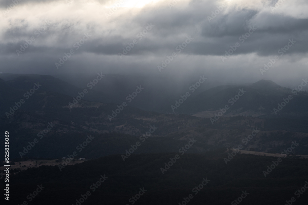 Stormy and cloudy view in the mountain valley.