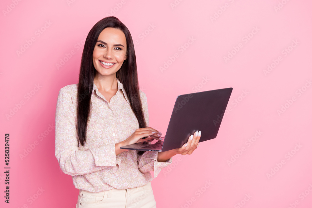 Photo of young attractive cute pretty woman professional programmer hold laptop isolated on pink color background Photo of young attractive cute pretty woman professional programmer hold laptop isolated on pink color background
