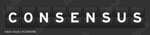 Black color analog flip board with word consensus on gray background