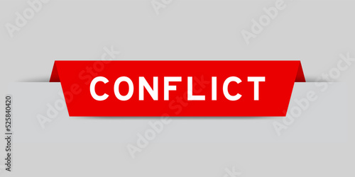 Red color inserted label with word conflict on gray background